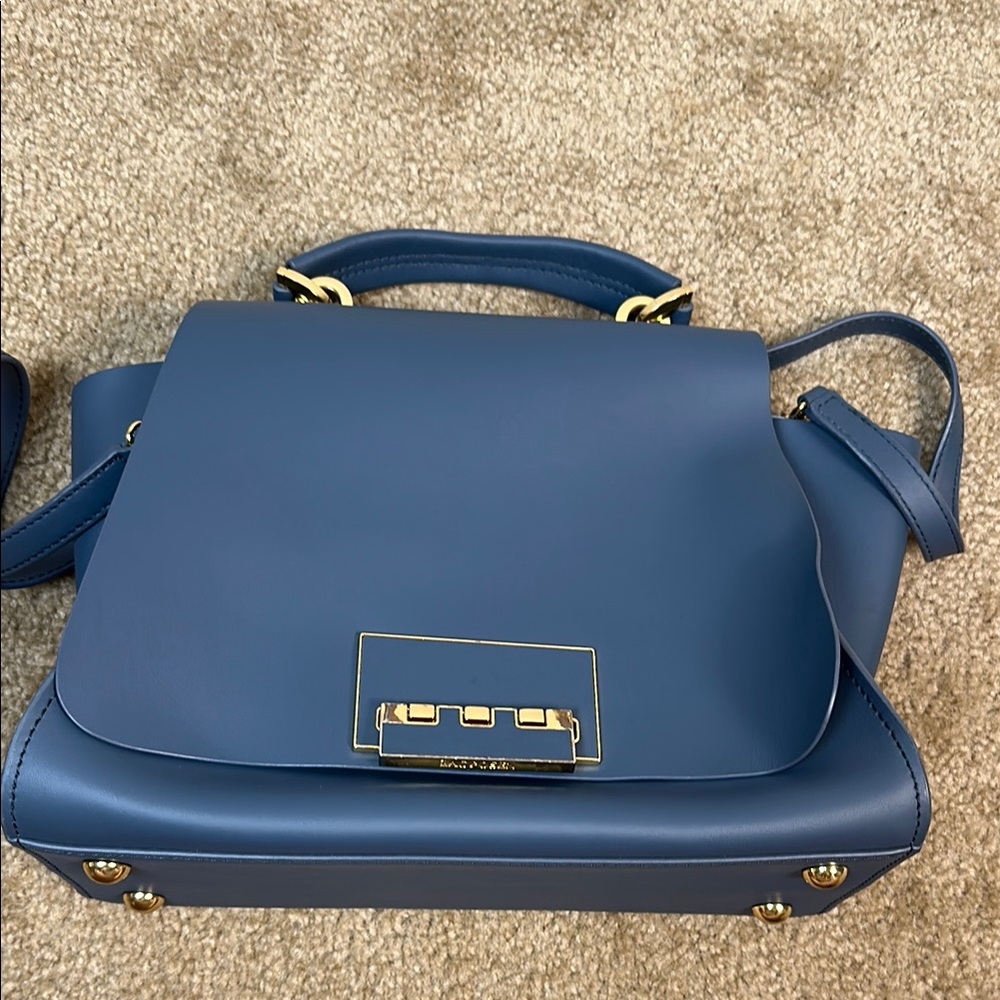 Elegant Blue Satchel with Top Handle and Shoulder Strap